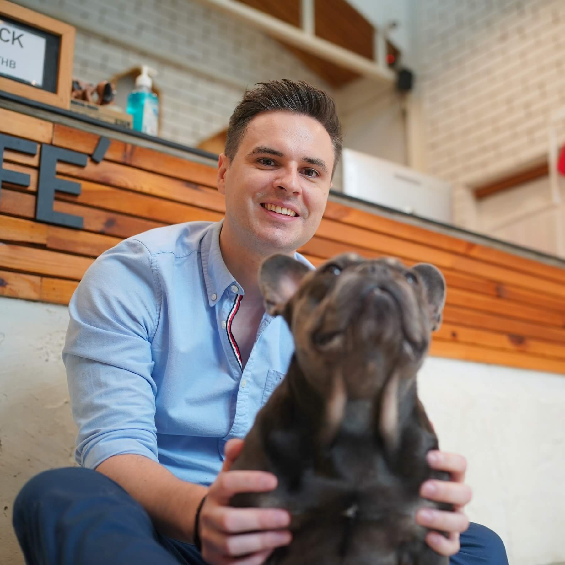 man and with his pet dog playing on the floor hap 2022 11 14 09 04 35 utc cropped