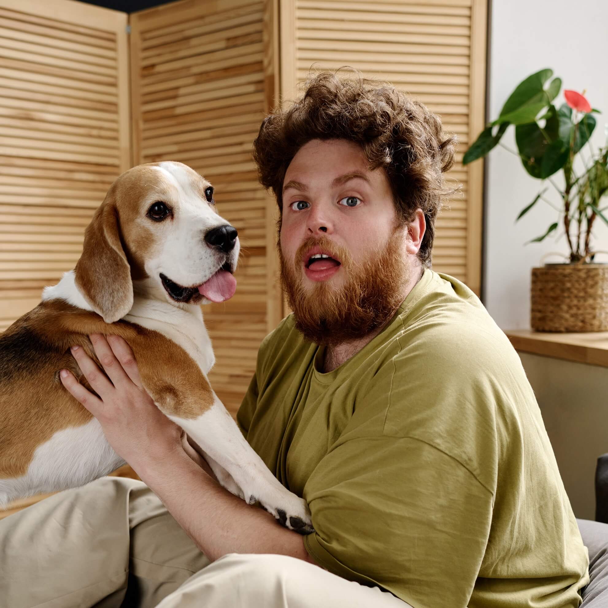 man fooling around with his pet 2022 05 02 15 33 57 utc cropped